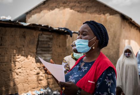 A woman responder wearing a protective face mask